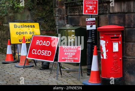 Too many road signs and a red letterbox at the corner of Fish Street and Wyle Cop, Shrewsbury, Shropshire, England, UK Stock Photo