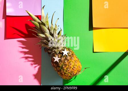 Colorful sticky notes on color paper background with party pineapple Stock Photo