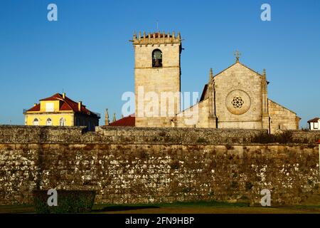 Gothic / Renaissance parish church / Igreja Matriz and part of town defensive wall, Caminha, Minho Province, Portugal Stock Photo