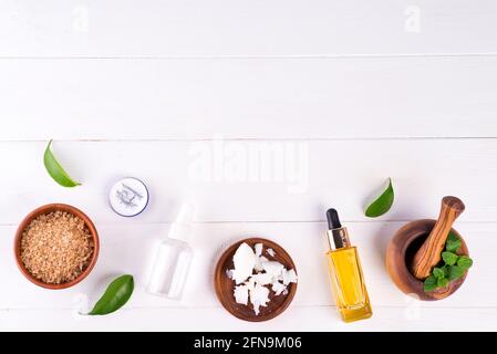 spa background with preparation handmade natural cosmetic products on white wooden background, flat lay Stock Photo