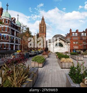 London, Greater London, England - May 11 2021: Brown Hart Gardens near Oxford Street. Ukrainian Catholic Cathedral left. Stock Photo