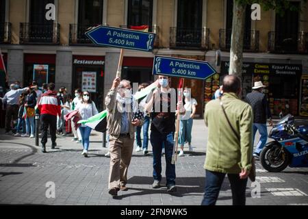 Madrid, Spain. 15th May, 2021. Protesters hold placards before the demonstration against the Israel attacks on the Palestinian people in Gaza. Credit: SOPA Images Limited/Alamy Live News Stock Photo