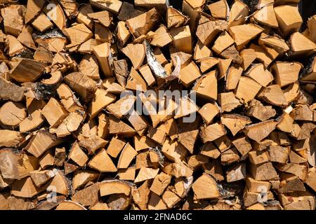 Wooden trunks timber harvesting. Log trunks pile, the logging timber forest wood industry. Stock Photo