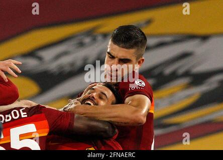 Rome, Italy. 15th May, 2021. Roma s Pedro, center, celebrates with his teammates after scoring during the Serie A soccer match between Roma and Lazio at the Olympic Stadium. Credit: Riccardo De Luca - Update Images/Alamy Live News Stock Photo