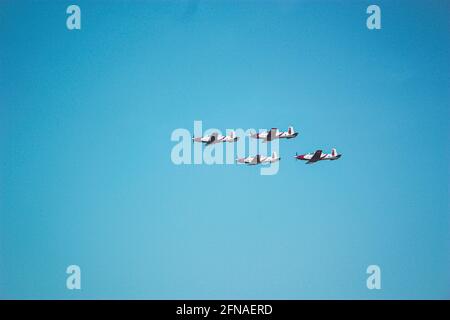 4 propeller planes flying in formation for an airshow Stock Photo