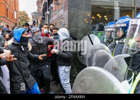 LONDON, ENGLAND, MAY 15 2021, Free Palestine protestors clash with police outside the Israeli Embassy on Kensington High Street, an estimated 150,000 people attended the protest on Saturday 15th May 2021. (Credit: Lucy North | MI News) Credit: MI News & Sport /Alamy Live News Stock Photo