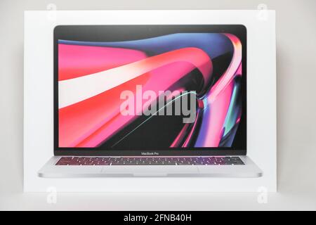 Princeton New Jersey May 15 2021:Apple M1 Touch bar and a Touch ID sensor integrated into the Power button, made by Apple Inc. on white background. - Stock Photo