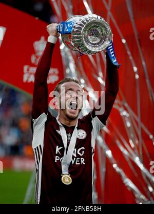 London, Britain. 15th May, 2021. Leicester City's James Maddison celebrates with the trophy after the FA Cup Final match between Chelsea and Leicester City at Wembley Stadium in London, Britain, on May 15, 2021. Credit: Matthew Impey/Xinhua/Alamy Live News Stock Photo