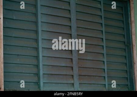 Blue metal window with anti insect grille Stock Photo