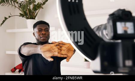 African american black man warming up his hands in front of the camera. High quality photo Stock Photo
