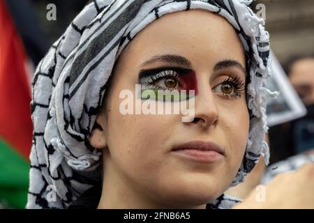 May 15, 2021, Boston, Massachusetts, USA: Woman with face paint of Palestinian flag around her eye during a rally in solidarity with the Palestinian people amid the ongoing conflict with Israel d in Boston. Stock Photo