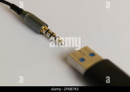 Audio plug from headphone or music device with USB connector Stock Photo