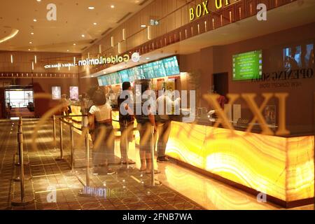 Jakarta, Indonesia. 13th Apr, 2021. The atmosphere of a cinema in the Kuningan area, Jakarta, on the second day of the Eid Al-Fitr 2021 holiday on Friday, May 14, 2021. The application of strict health protocols in theaters can reduce concerns about the risk of being exposed to the corona virus. Enjoying films in theaters is expected to be able to give back the exciting experience of watching on the big screen in the midst of a pandemic. (Photo by Kuncoro Widyo Rumpoko/Pacific Press) Credit: Pacific Press Media Production Corp./Alamy Live News Stock Photo