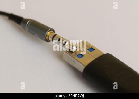 Audio plug from headphone or music device with USB connector Stock Photo