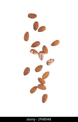 Almonds falling isolated on white background with clipping path. Stock Photo