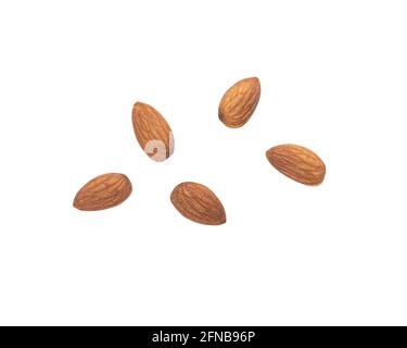 Almonds falling isolated on white background with clipping path. Stock Photo