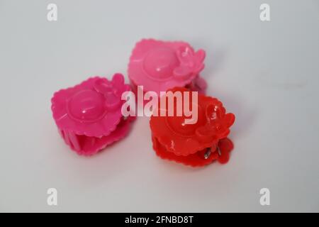 pink colored hair clip stock on white background Stock Photo