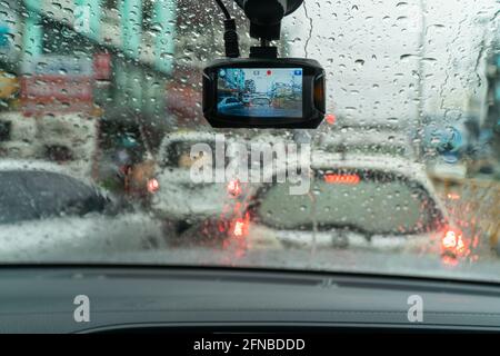 Raindrops on windshield from inside the car in traffic jam Stock Photo