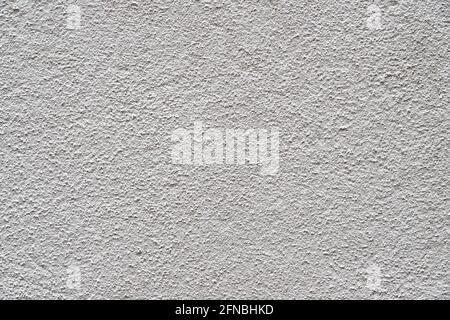 Heavily textured white and grey external plastered wall Stock Photo
