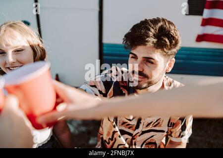 Group of Spanish young friends drinking toasts in the park Stock Photo