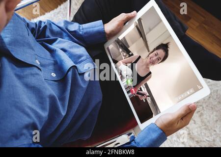 Video calls, E-learning, and online contents. a man using digital tablet Stock Photo