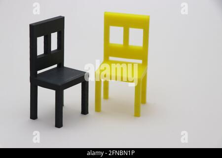 3D Printed small chairs on white background. 3D Printing technology objects Stock Photo