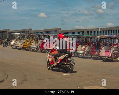 Ambon, Indonesia - Feb, 2018: Becaks, the traditional transportation in Indonesia. (Beca, Betjak, Betja, or Beetja). It is the Indonesian incarnation Stock Photo