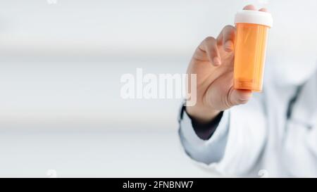 Doctor recommends taking medicine, vitamins, food supplement. Prescribing drug Stock Photo
