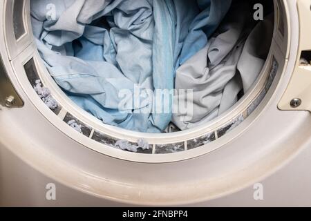 Lint from fabric trapped on laundry dryer filter Stock Photo