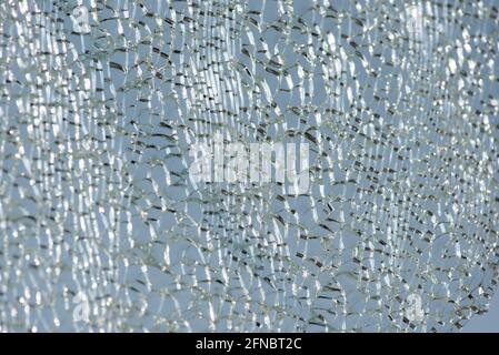 Shattered, cracked glass backlighting, destoryed wildscreen Stock Photo