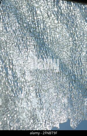 Shattered, cracked glass backlighting, destoryed wildscreen Stock Photo