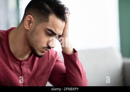 Closeup portrait of upset arab guy having difficulties Stock Photo