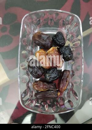 Phoenix dactylifera, commonly known as date or date palm, is a flowering plant species in the palm family Stock Photo