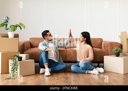 Happy man and woman giving high five Stock Photo