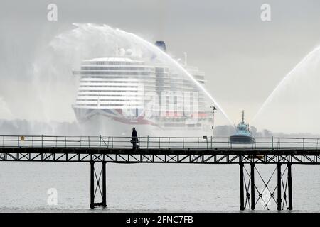 Southampton UK 16th May 2021. P&O Cruises latest edition to the fleet Iona arrives in Southampton in heavy rain ahead of her naming ceremony today (16-05-21) by the Ships Godmother Dame Irene Hays in a virtual ceremony that will include a live performance from singer Gary Barlow and hosted by DJ and Broadcaster Jo Whiley. Dame Hays founded Hays Travel in 1980 with her husband John who died suddenly in November 2020. P&O's Iona is the largest cruise ship built for the UK market and can hold 5200 passengers and 1800 crew, she is 344m in length. She also is the first British cruise ship to be pow Stock Photo