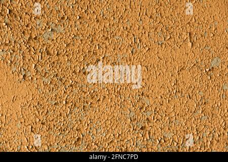Plastered old wall with cracked and peeling paint. Stock Photo