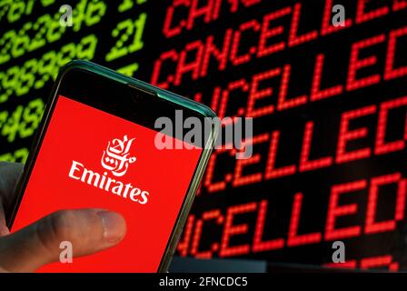 China. 23rd Apr, 2021. In this photo illustration the United Arab Emirates Emirates airline logo is seen on an Android mobile device with a computer key which says cancel and cancelled. Credit: Budrul Chukrut/SOPA Images/ZUMA Wire/Alamy Live News Stock Photo