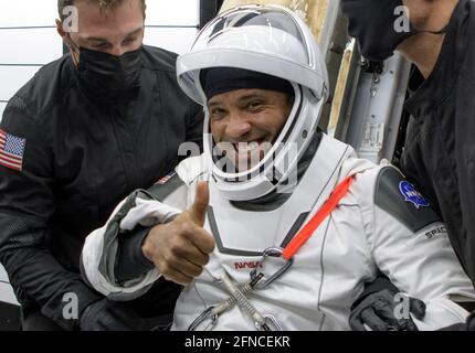 NASA astronaut Victor Glover is helped out of the SpaceX Crew Dragon Resilience spacecraft onboard the GO Navigator recovery ship after splashdown in the Gulf of Mexico May 2, 2021 off the coast of Panama City, Florida.  The capsule carried NASA SpaceX Crew-1 astronauts Mike Hopkins, Shannon Walker, and Victor Glover, and JAXA astronaut Soichi Noguchi back to earth from the International Space Station. Stock Photo