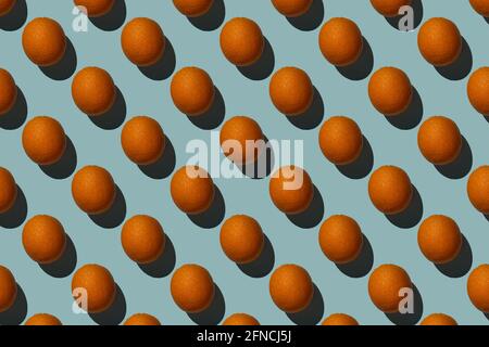 Brown eggs pattern on blue background Hard shadows Stock Photo