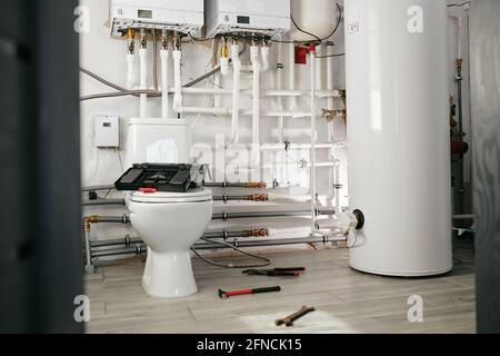 A toilet in large modern house during repair works Stock Photo
