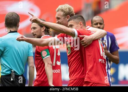 Duesseldorf, Germany. 16th May, 2021. Football: 2. Bundesliga, Fortuna Düsseldorf - Erzgebirge Aue, 33. matchday at Merkus Spiel-Arena: Düsseldorf's striker Kristoffer Peterson (r) cheers with Düsseldorf's defender Christoph Klarer about his goal for 3:0. Credit: Bernd Thissen/dpa - IMPORTANT NOTE: In accordance with the regulations of the DFL Deutsche Fußball Liga and/or the DFB Deutscher Fußball-Bund, it is prohibited to use or have used photographs taken in the stadium and/or of the match in the form of sequence pictures and/or video-like photo series./dpa/Alamy Live News Stock Photo