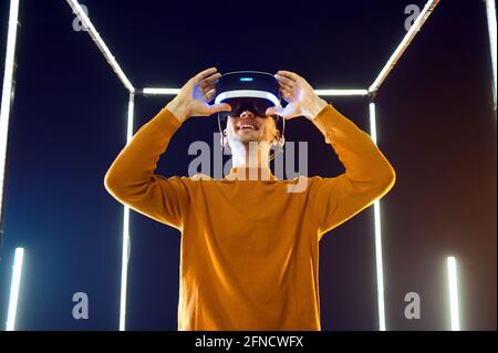 Male gamer using virtual reality headset Stock Photo