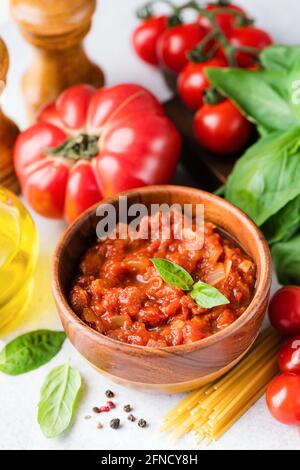 Tomato sauce marinara and ingredients for spaghetti pasta. Italian cuisine food Stock Photo