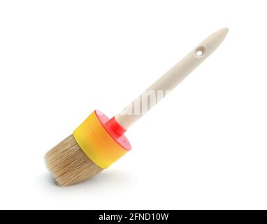 Large paint brush with wooden handle isolated on white. Stock Photo
