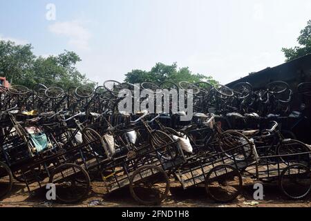 Kolkata, India. 02nd Jan, 2014. Hand pulled van rickshaws seen parked in a Garage following the 15 day lockdown in Kolkata. People desert the streets as West Bengal government declares a 15 day lockdown starting today to curb the rising cases and deaths of COVID19 infections. Credit: SOPA Images Limited/Alamy Live News Stock Photo