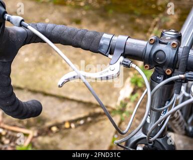 Close and selective focus on the drop handle bars brake lever and gear shifter of a road racing bicycle Stock Photo Alamy