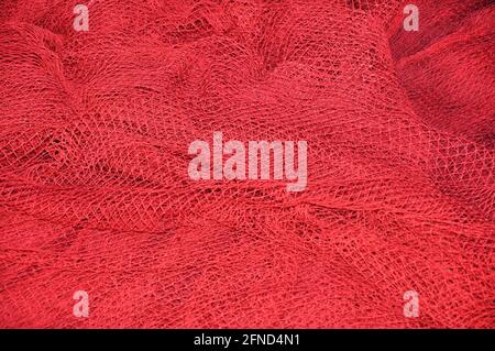 Fisher net close up. Colourfoul Fisher net close-up and details. Red fishing Nets Textured Background Stock Photo