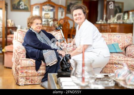 NURSE AND ELDERLY PERSON Stock Photo