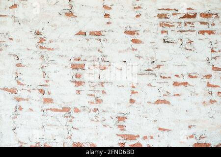 Old chipped white brick wall texture background. Vintage Wide Old Red White Brick Wall Texture Background. whitewashed grungy brick wall, abstract red Stock Photo