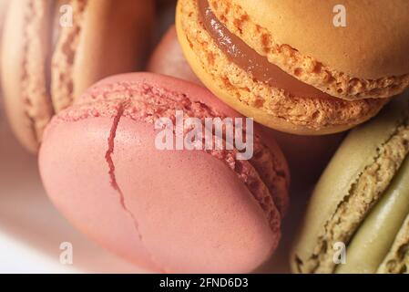 Different sorts of pastel colored macaroons. Food, culinary and cooking concept. Stock Photo